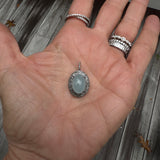 Puffy Aquamarine Oval Pendant with Diamond Border