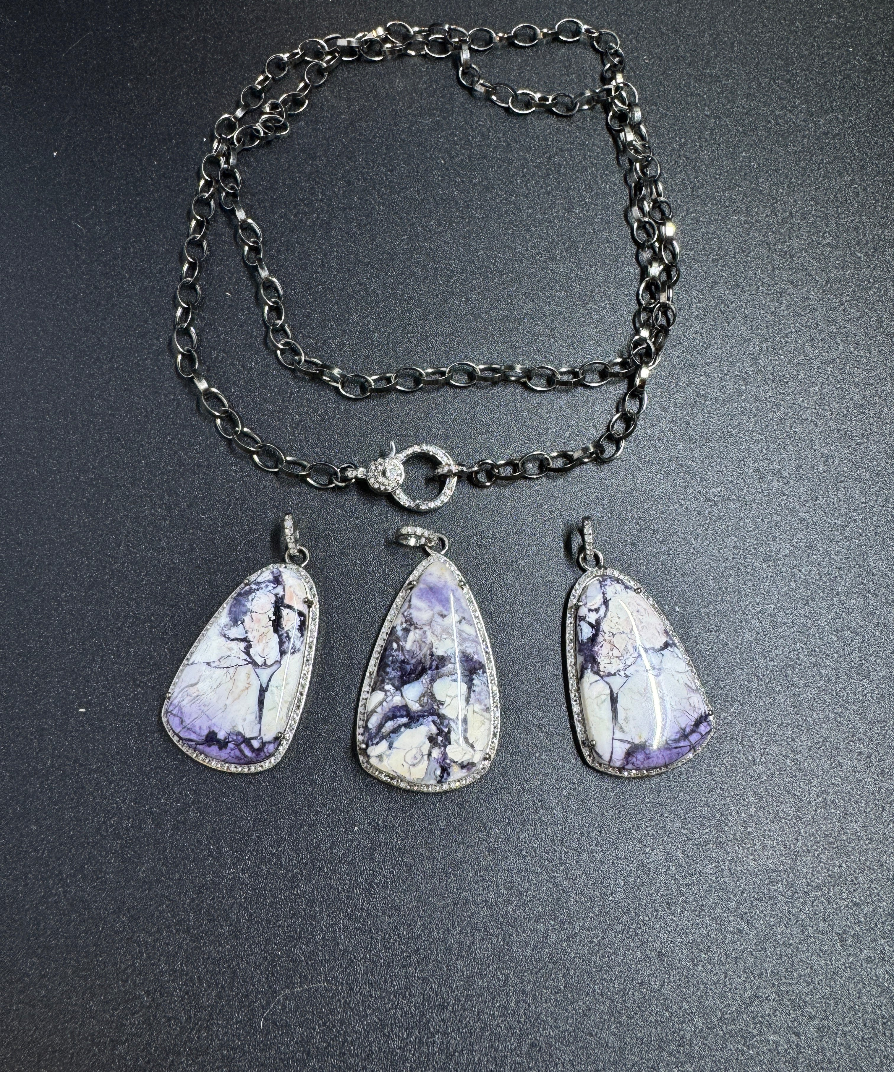 Bertrandite and Diamond Pendants