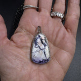 Bertrandite and Diamond Pendants